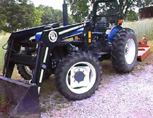 Picture of a Ford 3950 tractor with ZENA mobile welding system installed -- a Ford mobile welder
