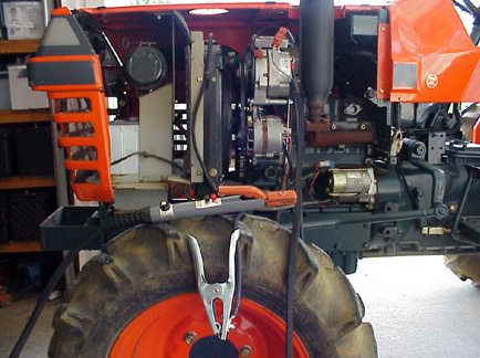 Side view of Kubota tractor with welding system installed